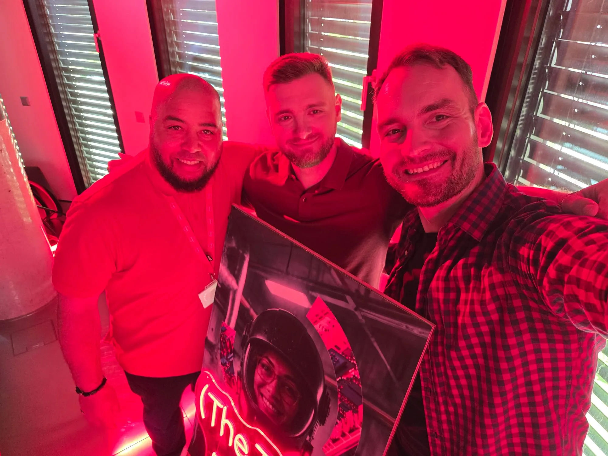 Three of us at the end of the shoot, holding the show artwork